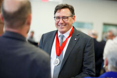 Larry D. Singell, former executive dean of the College of Arts and Sciences, wears the IU President's Medal for Excellence.